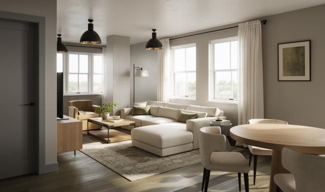 a living room with a couch and chairs